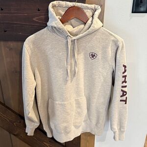 Ariat cream with a very light brown color Hoodie with burgundy Accents size M